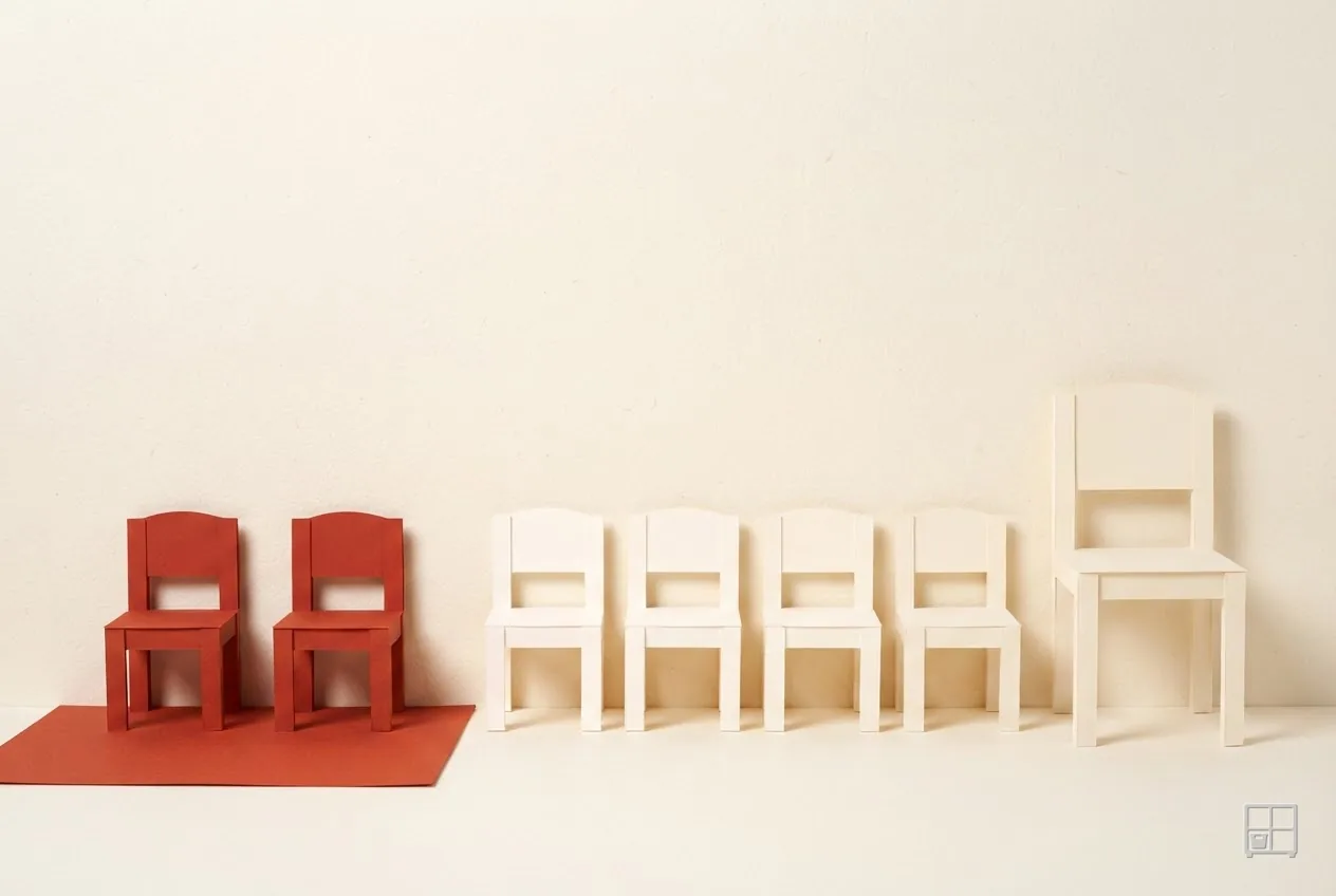 Cut-paper collage of two red chairs on a red mat beside four cream chairs in a line