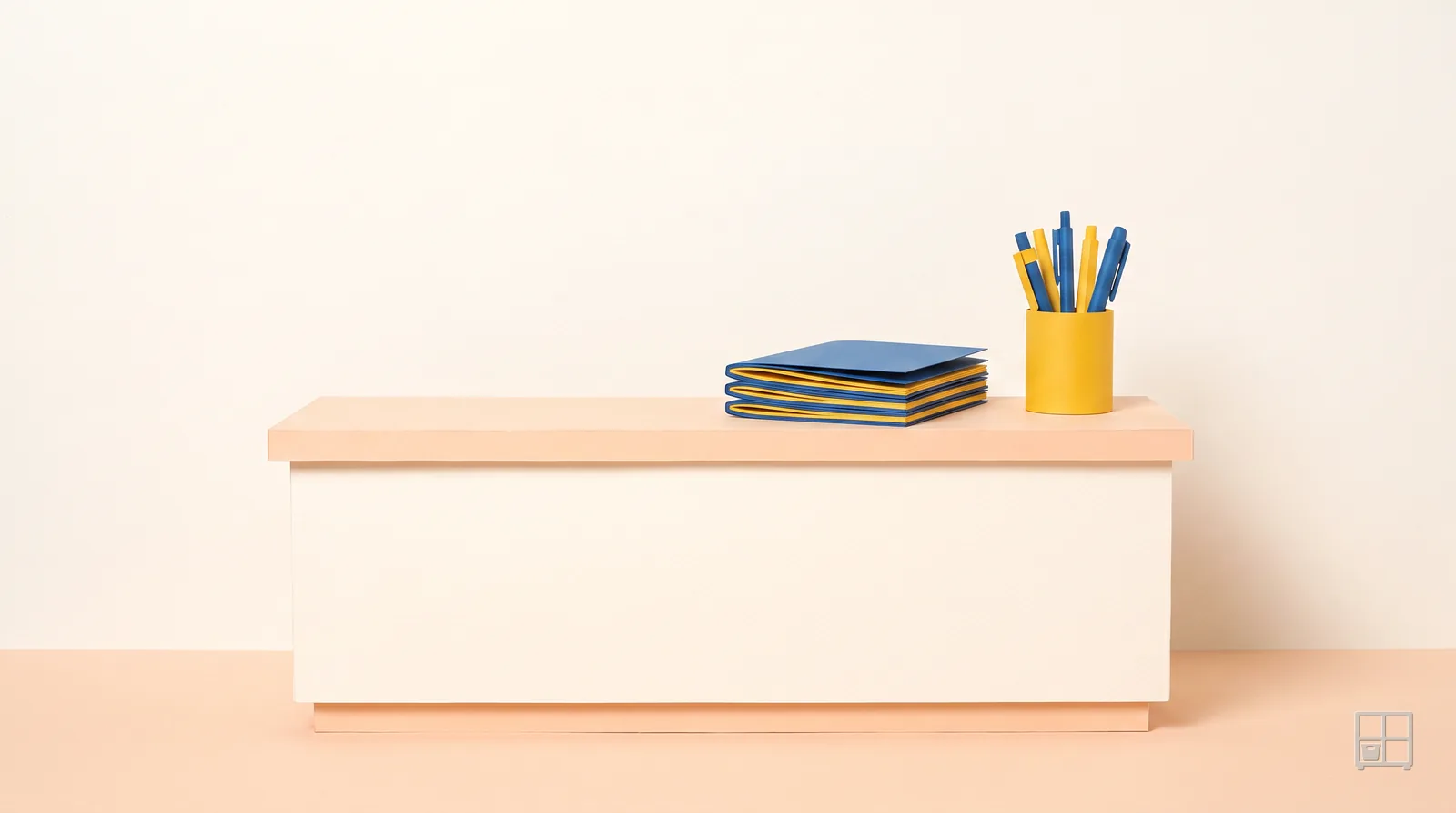 Cut-paper collage of a stack of blue books and a pot of pens on a plain counter